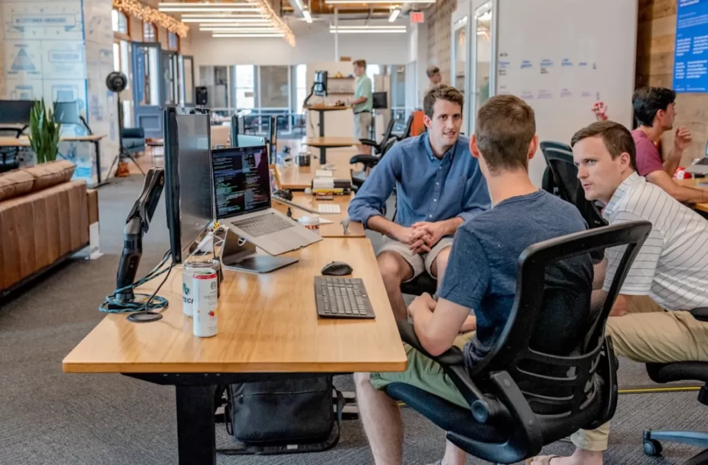 Team discussing ideas in a collaborative workspace.